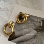 Baroque Golden Clip-On Hoop Earrings - Image 10